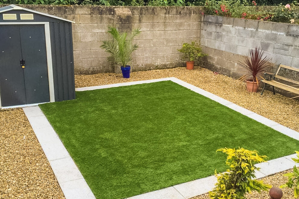 Square lawn edged with paving and gravel Garden fence installation Dublin